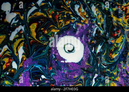 Multicolored acrylic background with dark streaks and white spots, sprinkled with glitter. Modern creativity. Colorful avant-garde eye pattern with ri Stock Photo