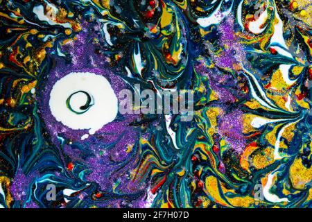 Multicolored acrylic background with dark streaks and white spots, sprinkled with glitter. Modern creativity. Colorful avant-garde eye pattern with ri Stock Photo