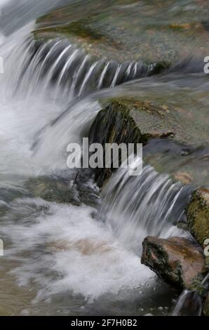 Cascade flowing over rocks on Pigeon Creek in the Ouachita National Forest Stock Photo