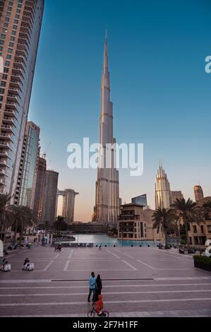 Dec 14th 2020, Dubai, UAE. View of the Burj Khalifa , the DSF markets, dubai mall, Souq al bahar and other buildings captured at dusk with blue sky.