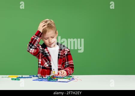 children playing with electronic constructor at studio Stock Photo
