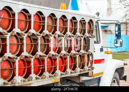 Compressed propane gas bottles are safely transported and stored in dedicated industrial equipment. Stock Photo