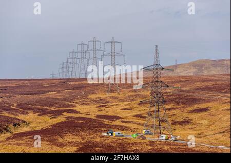 Power lines being removed on the hills between Kilmacolm and Inverkip Stock Photo