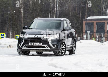 MOSCOW, RUSSIA - JANUARY 30, 2021 Mitsubishi Outlander. Third generation of Japanese compact crossover SUV produced by Mitsubishi Motors. Model year 2 Stock Photo