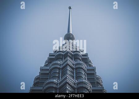 Detail of top of Petronas towers in Kuala Lumpur viewed directly from below. Architectural marvel in Malaysia, detail of one of the twin towers. Stock Photo