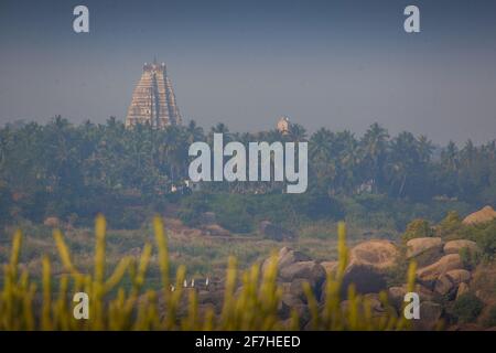 Ancient ruins in Hampi, Karnataka, India. Virupaksha temple at Hampi seen from far. Stock Photo