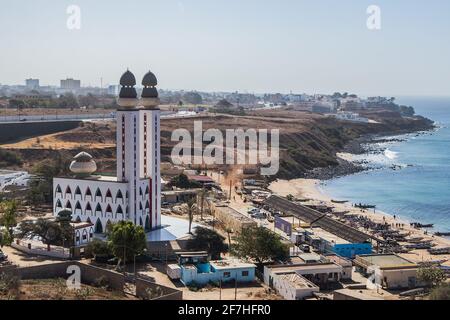 Mosque of divinity or mosquee de la divinite in Dakar, Senegal, viewed from a higher perspective on a sunny day. City of Dakar in the background. Stock Photo