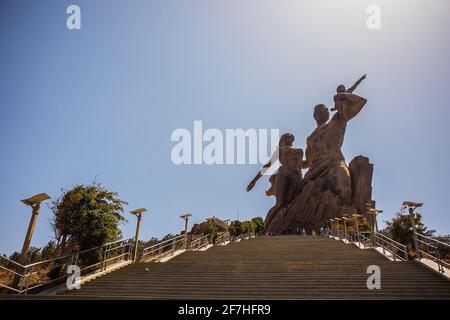 The statue of african renaissance or 'monument de la renaissance africaine' on a sunny february day in Dakar, Senegal. View from the bottom of the sta Stock Photo