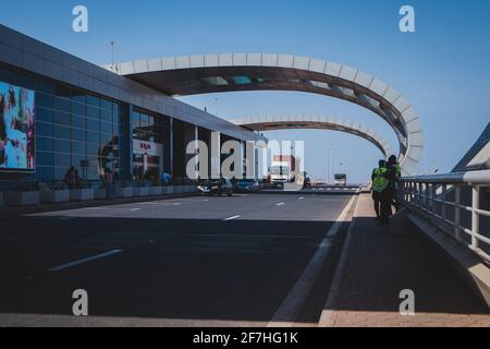 DAKAR, SENEGAL, FEBRUARY 22 2018: Departure platform on the new Blaise Diagne airport in Dakar, Senegal on a sunny day. Some people, security guards a Stock Photo