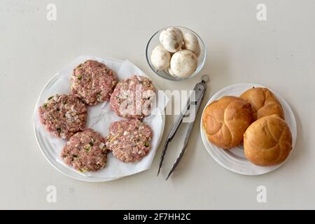 Fresh stuffed gourmet hamburgers for picnic summer grilling, father's day. Photo concept, food background, copy space Stock Photo