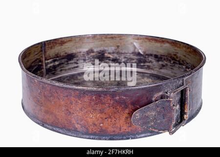 Old dirty baking trays. Accessories used in the kitchen for the preparation of desserts. Isolated background. Stock Photo