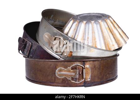 Old dirty baking trays. Accessories used in the kitchen for the preparation of desserts. Isolated background. Stock Photo