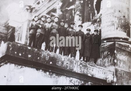 Soviet soldiers on the pediment of the Reichstag in Berlin in 1945. Stock Photo