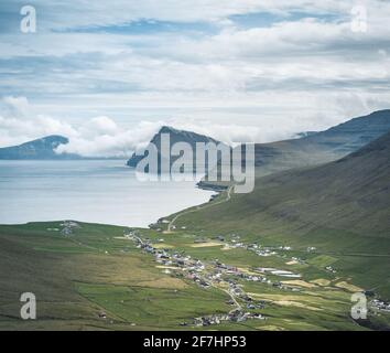 Faroe Islands Panoramic view from Kap Enniberg to the small village Vidareidi, its fjords, Kunoy island and mountains Stock Photo