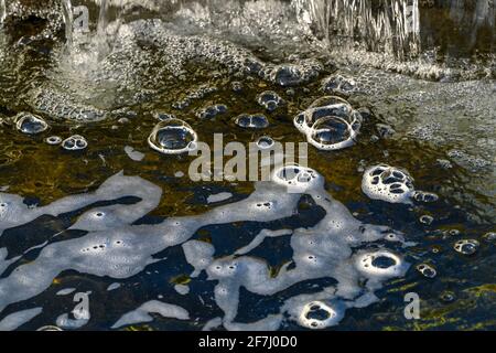 Bubble domes on water created by aeration from mini waterfall Stock Photo