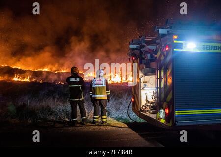 Bantry, West Cork, Ireland. 8th Apr, 2021. A massive gorse fire decimated hundreds of acres in Seskin, Bantry through the night. Three units of Bantry Fire Brigade attended the scene and through the use of controlled burning, hoses and beaters, brought the fire under control. It is thought the fire was started deliberately. Credit: AG News/Alamy Live News Stock Photo