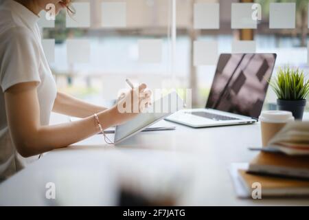User experience concept. Creative Web Designer sketching application and developing template layout on laptop, framework for digital devices. Stock Photo