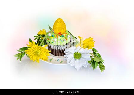 Spring Easter Cupcake and flowers on a white background. Stock Photo
