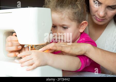 Premium Photo  Little girl learning how to sew with sewing craft kit for  kids