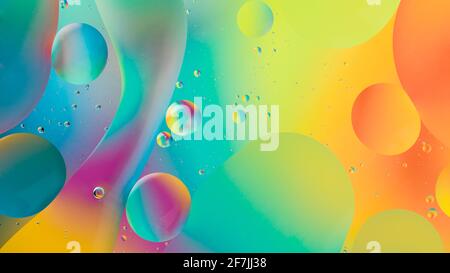 oil drops on water with colorful gradient background Stock Photo