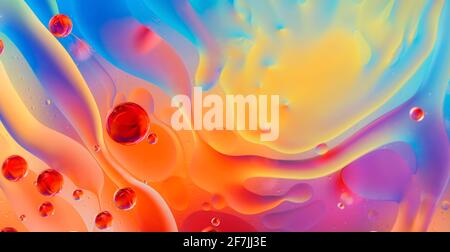 abstract colorful backdrop with oil drops and waves on water surface Stock Photo
