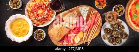 Italian food variety panorama. An assortment of dishes of the cuisine of Italy Stock Photo