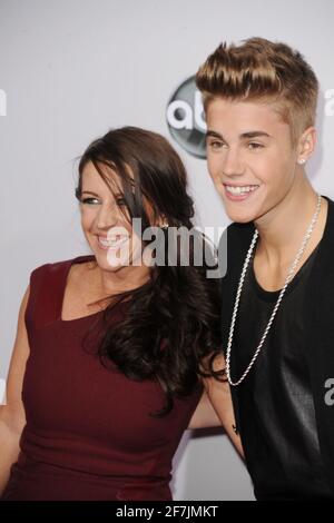 LOS ANGELES, CA - NOVEMBER 18: Justin Bieber, at right, and his mother, Pattie Malette at The 40th Annual American Music Awards at The Nokia Theater L Stock Photo