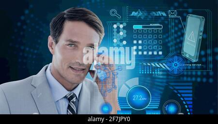 Composition of data processing over caucasian man using a smartphone in background Stock Photo