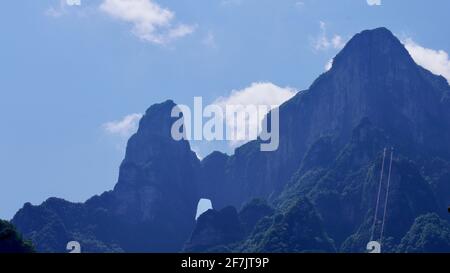 Green mounatins with river valley geomorgy under blue sky in Zhangjiajie national forest park. Stock Photo