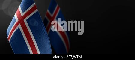 Small national flags of the Iceland on a dark background Stock Photo