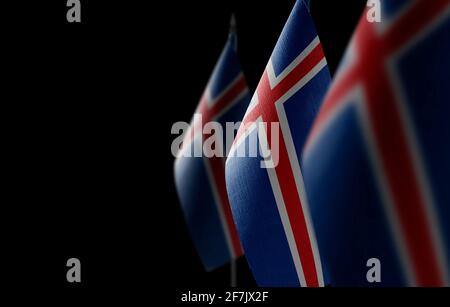 Small national flags of the Iceland on a black background Stock Photo