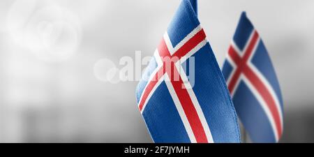 Small national flags of the Iceland on a light blurry background Stock Photo