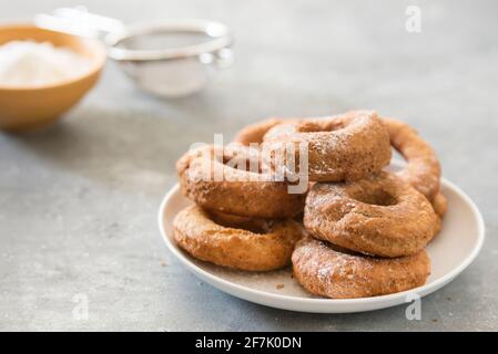Homemade donuts sugar glazed on a stone background Stock Photo