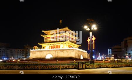 Xi'an Bell Tower which was built in 1384 with lights on during night time. Stock Photo