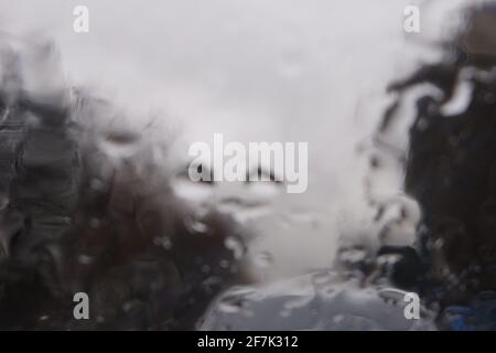 Water Drops on Window at a Rainy Day, Trees Roadside Stock Photo