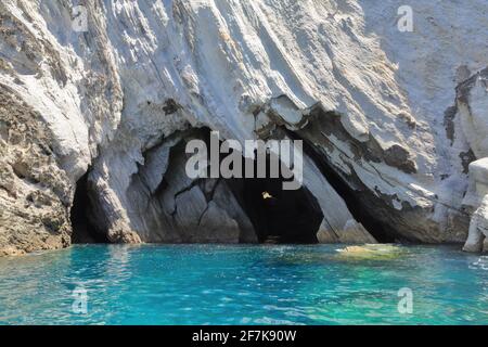 A sea cave in steep white coastal cliffs. Coromandel Peninsula, New Zealand Stock Photo