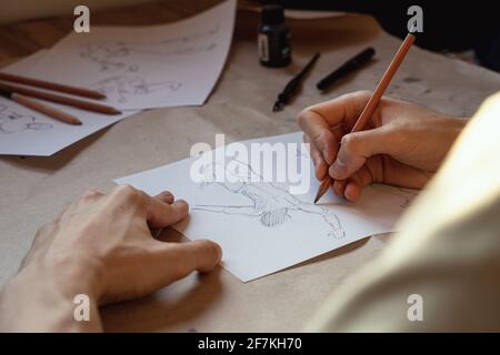 Artist drawing figure pencil sketches. Artwork background Stock Photo