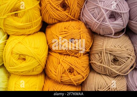 Background from multi-colored fluffy woolen threads for knitting closeup. Stock Photo