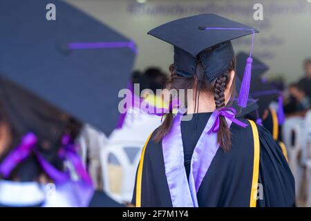 Closeup of Diploma graduating little student kid in school Stock Photo