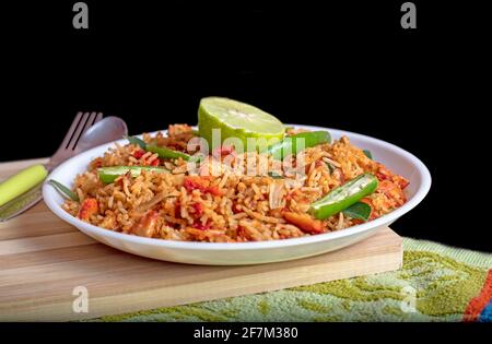 Fried rice with chicken. Prepared and served in the Natural wood background. Top views. Stock Photo