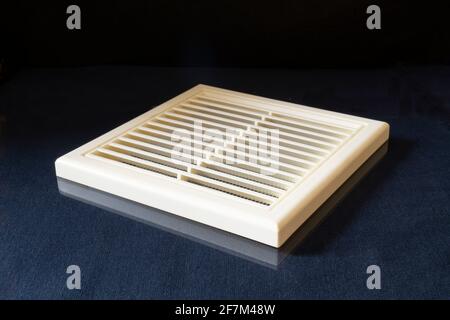 Decorative grid for ventilation of the room on the table. A white object on a black background Stock Photo