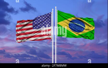 Two waving state flags of United States and Brazil on the blue sky. High - quality business background. 3d illustration Stock Photo