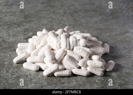 A pile of white pills Stock Photo