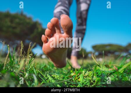 https://l450v.alamy.com/450v/2f7mbth/healthy-woman-walking-barefoot-on-green-grass-in-summer-closeup-of-woman-feet-walking-on-the-ground-and-exercise-2f7mbth.jpg