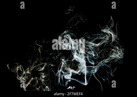 Grey smoke abstract texture, isolated effect with dark background Stock Photo