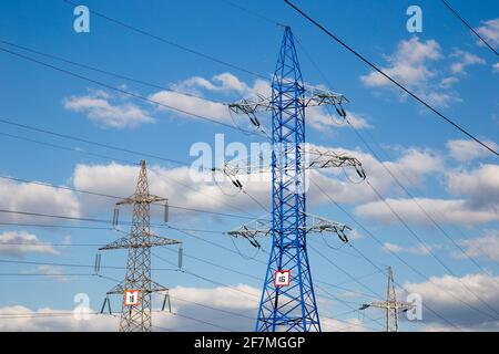 Electricity and lighting. High voltage power line pylons against the sky. Stock Photo
