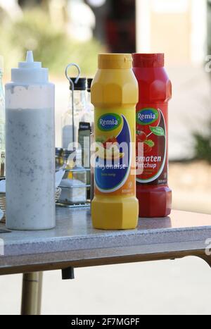 Mayonaise & Tomato sauces on a restaurant cafe table in the seaside town of Lloret de Mar on the Costa Brava near Calella in Catalonia Spain EU 2019 Stock Photo