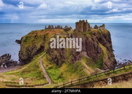 Dunnottar Castle ruins, Scotland - Dunnottar is a ruined medieval fortress located upon a rocky headland on the north-east coast of Scotland Stock Photo