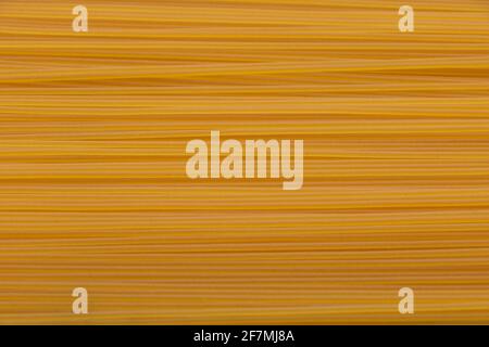 Raw italian spaghetti close up textured background Stock Photo