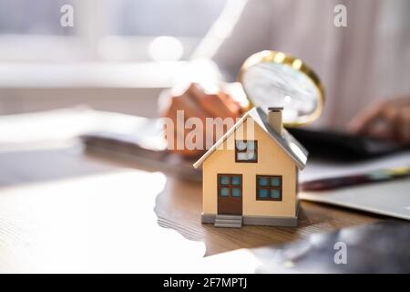 House Inspection With Magnifying Glass. Investigate Real Estate Rent Stock Photo